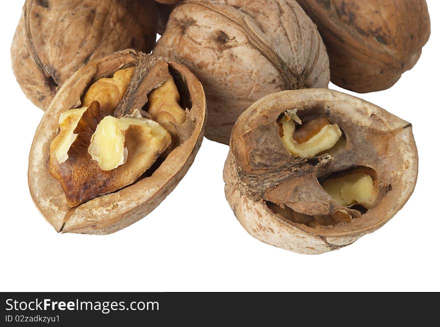 Some walnuts fragment (whole and a cracked) isolated over white background