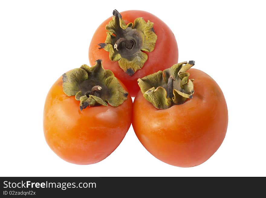 Three ripe persimmons isolated over white background (macro shot). Three ripe persimmons isolated over white background (macro shot)