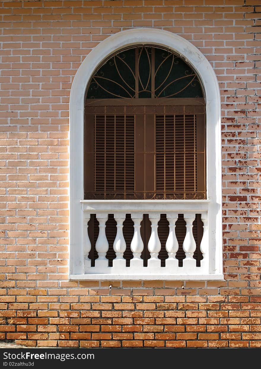 Window with a brick wall tiles apparent. Window with a brick wall tiles apparent