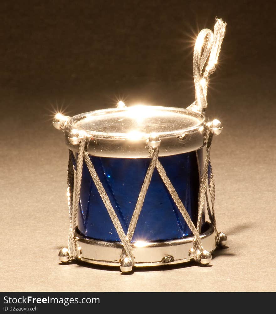 A blue and silver drum Christmas ornament. A blue and silver drum Christmas ornament.