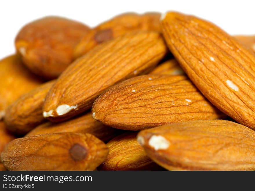 Many almonds on white background