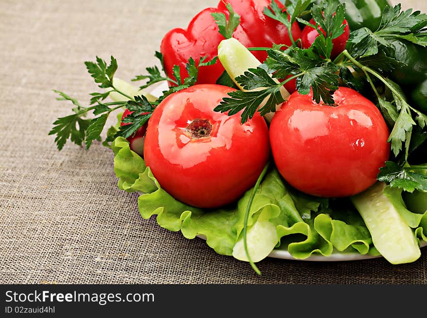 Food theme: fresh vegetables and greens on a plate. Food theme: fresh vegetables and greens on a plate.