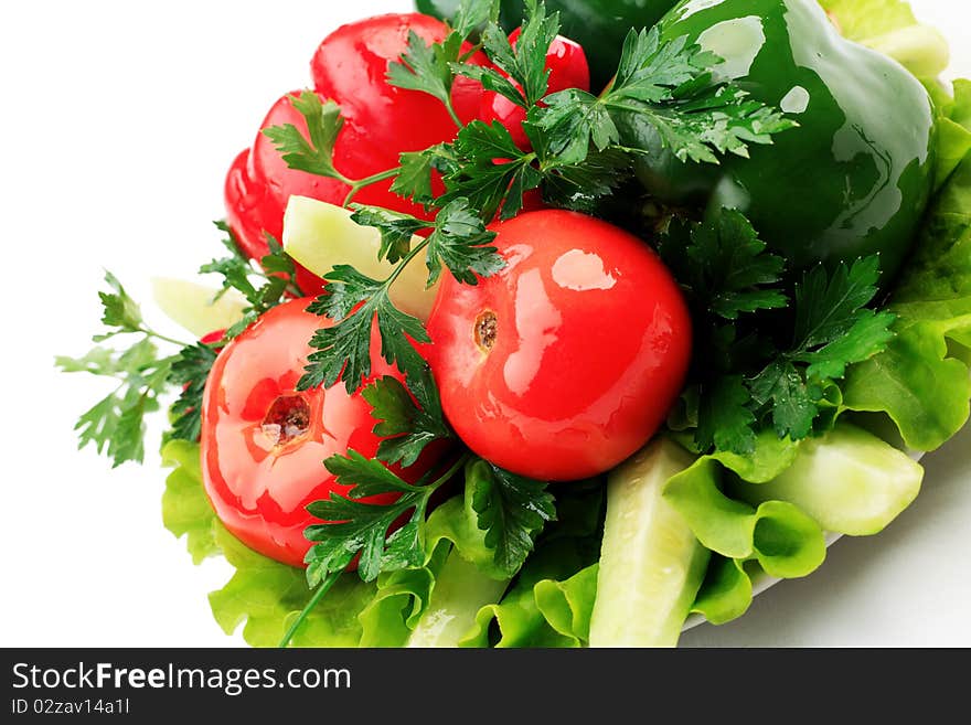 Food theme: fresh vegetables and greens on a plate. Food theme: fresh vegetables and greens on a plate.