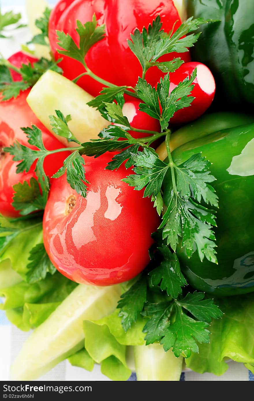 Food theme: fresh vegetables and greens on a plate.