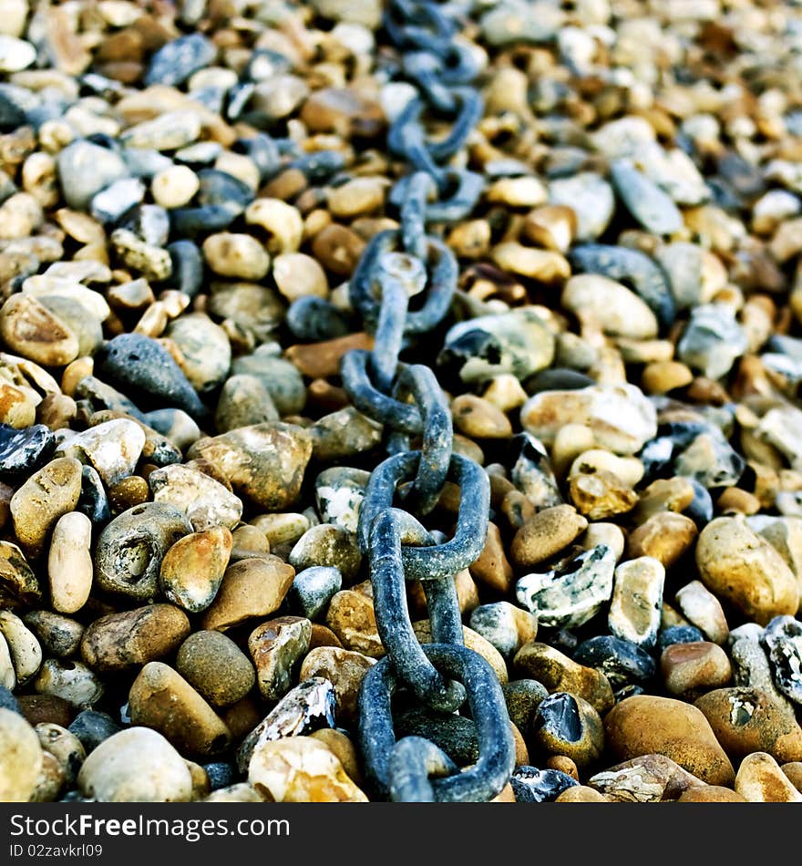 Chain on pebbles