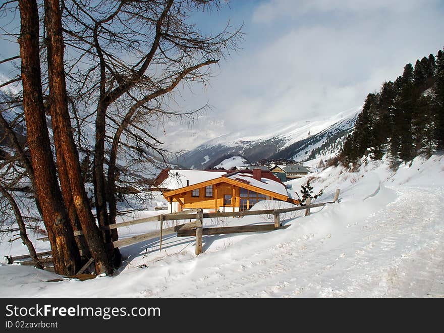 The picture of a small house in the mountains. The picture of a small house in the mountains