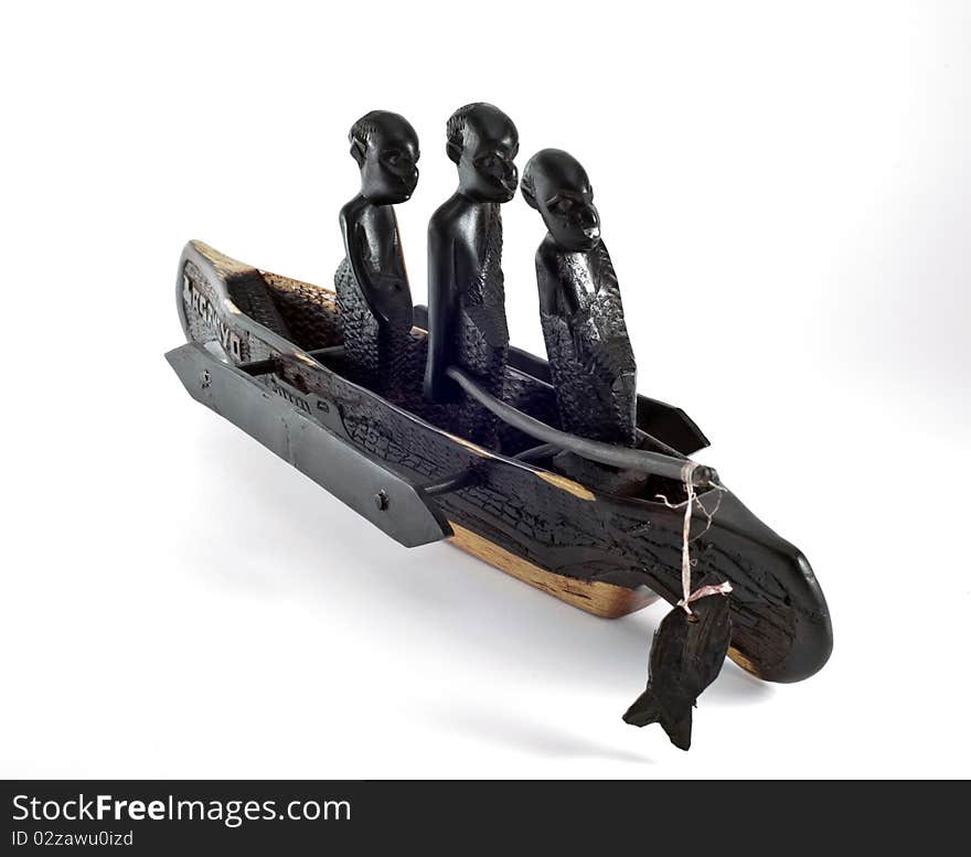 A boat carved out of wood on white background. A boat carved out of wood on white background