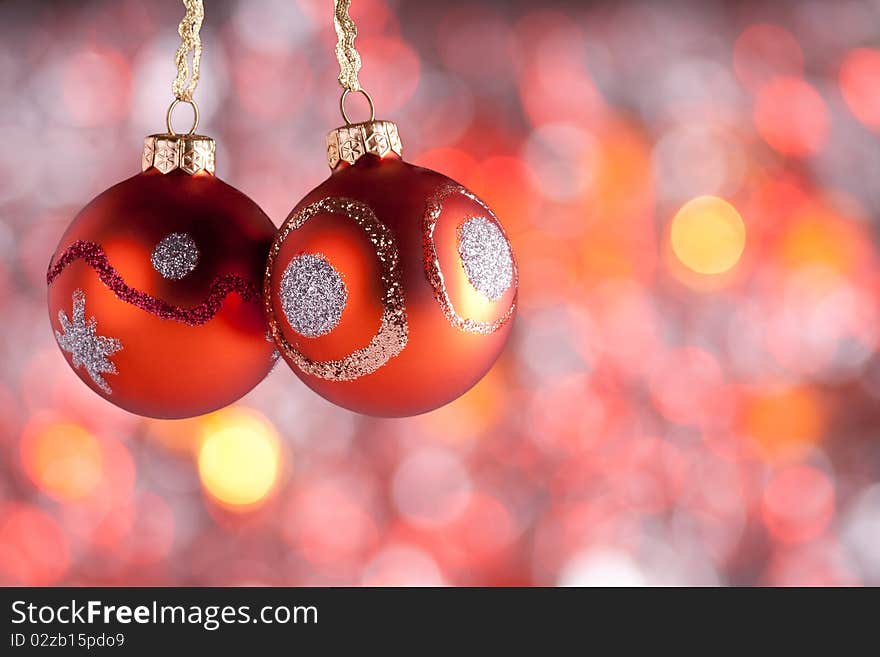 Christmas Ornaments in front of abstract, blurred lights background. Christmas Ornaments in front of abstract, blurred lights background