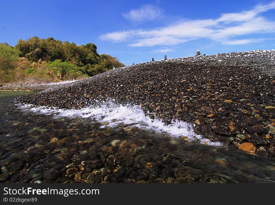 Sea wave on rock island