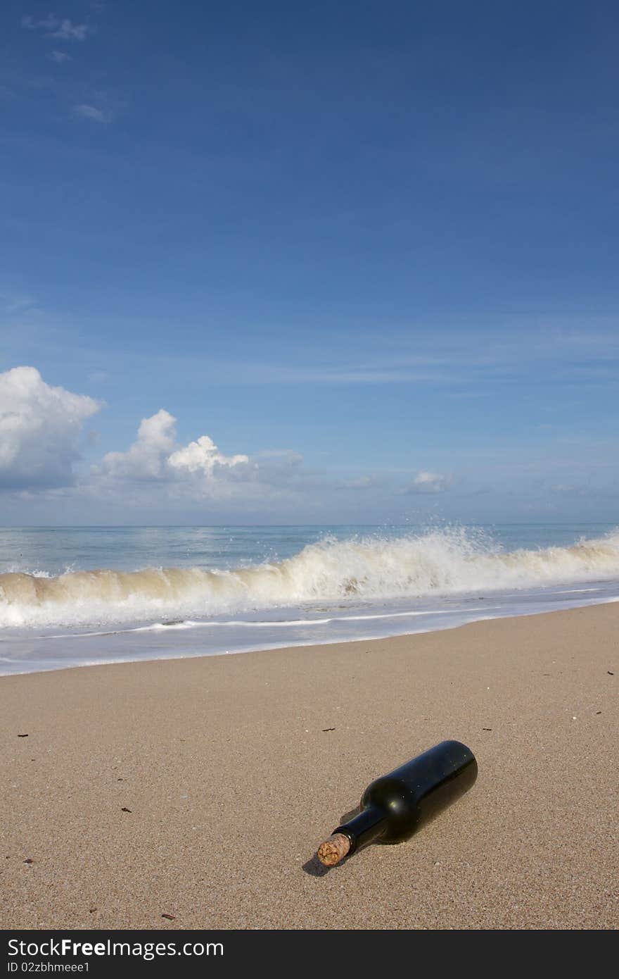 Waves puts the blame on each other a bottle overlaps the beach. Waves puts the blame on each other a bottle overlaps the beach