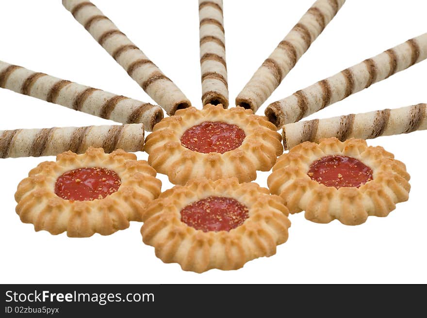 Sweet round biscuits covered with chocolate glaze on a white background closeup