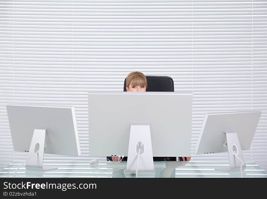 Attractive blond business woman in her clean office. Attractive blond business woman in her clean office