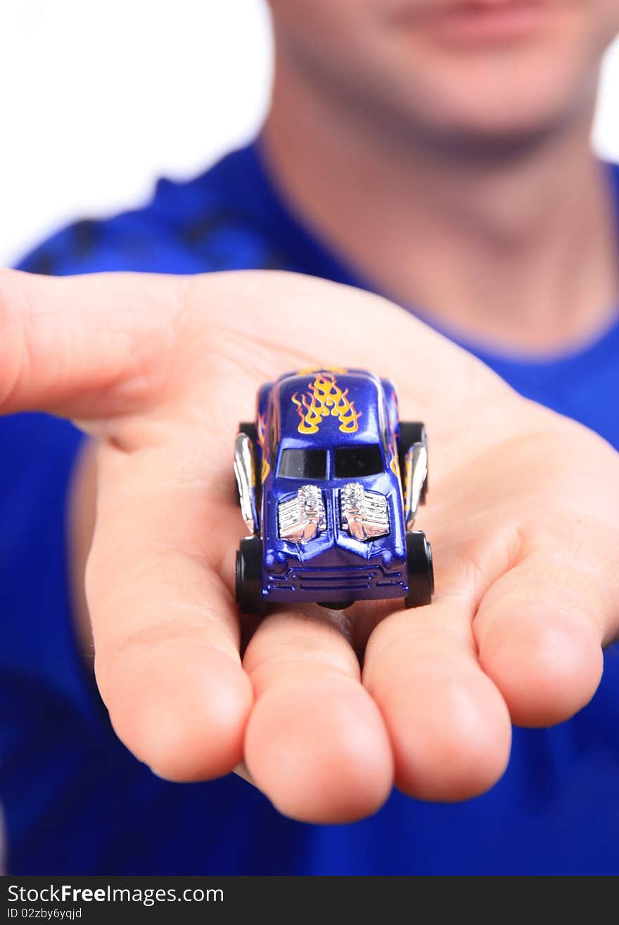 Man holding out a car with good depth of field. Man holding out a car with good depth of field