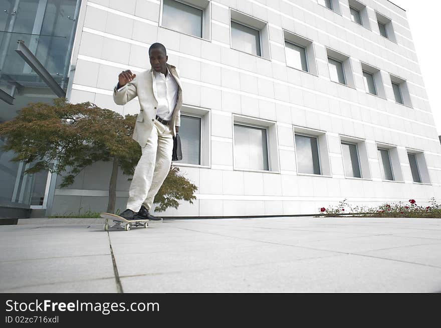 Businessman on skateboard