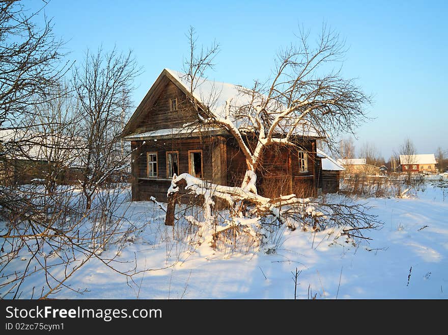 Old rural house in snow