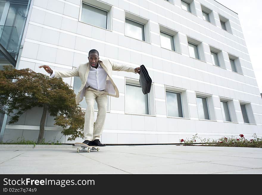 Businessman on skateboard; could be a ecological mode of transport