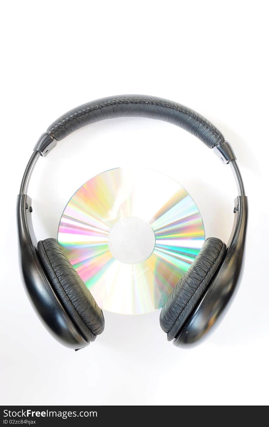 Close-up view of headphone with compact disc. Close-up view of headphone with compact disc.