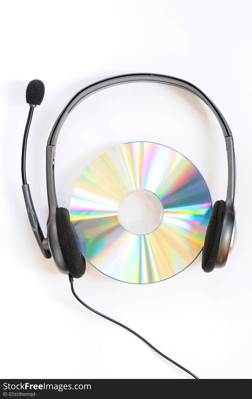 Close-up view of headphone with compact disc. Close-up view of headphone with compact disc.