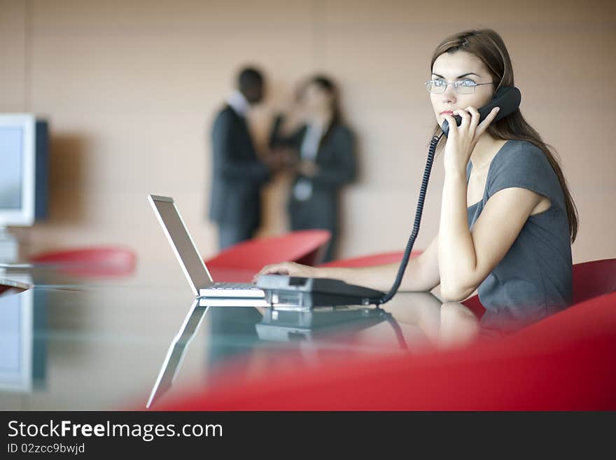 Portrait of a young businesswoman, colleagues on backgrounds. Portrait of a young businesswoman, colleagues on backgrounds