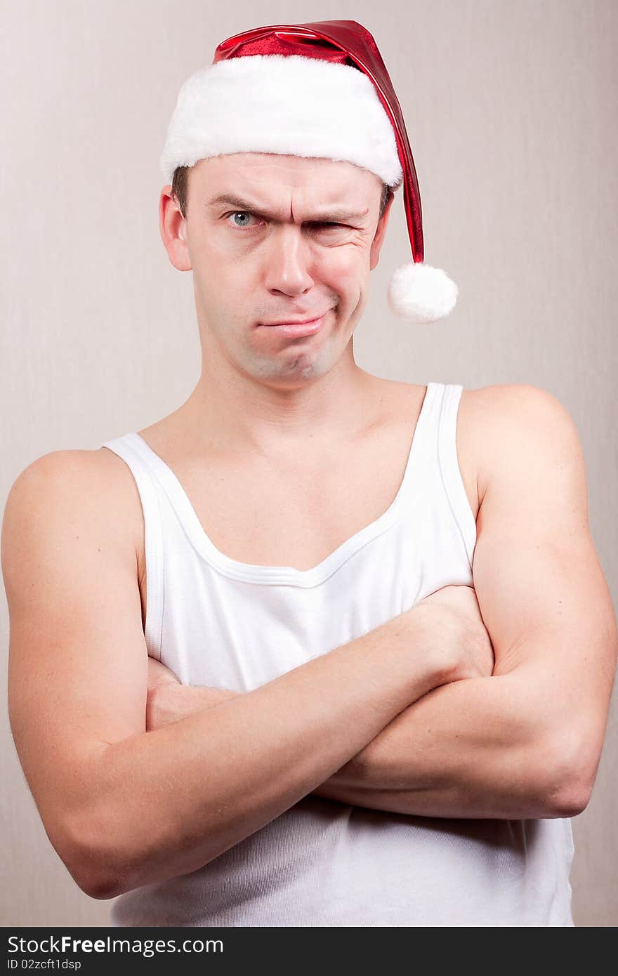 Gruff man in santa hat