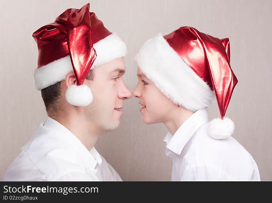 Happy teen and man in santa hat