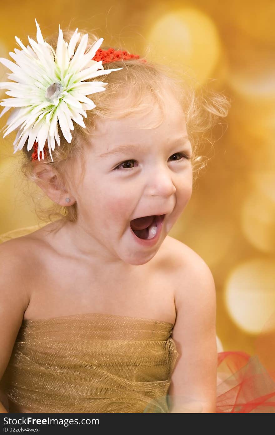 Young toddler with huge happy expression on her face. She is dressed for Christmas. Young toddler with huge happy expression on her face. She is dressed for Christmas