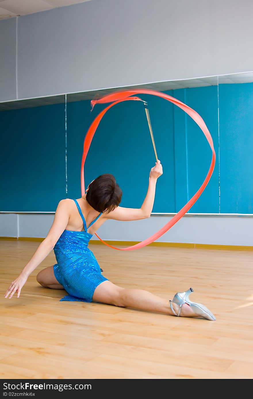 Young woman doing gymnastic exercise