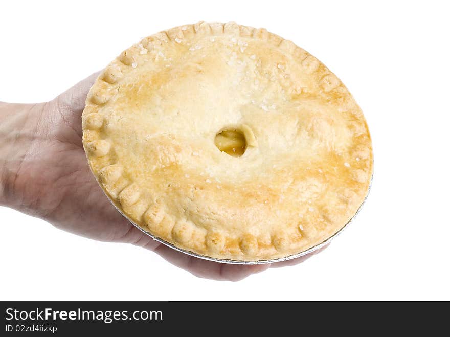 Hand Holding An Apple Pie