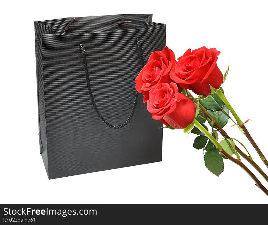 Black bag for a retail shopping experience with red roses. Black bag for a retail shopping experience with red roses