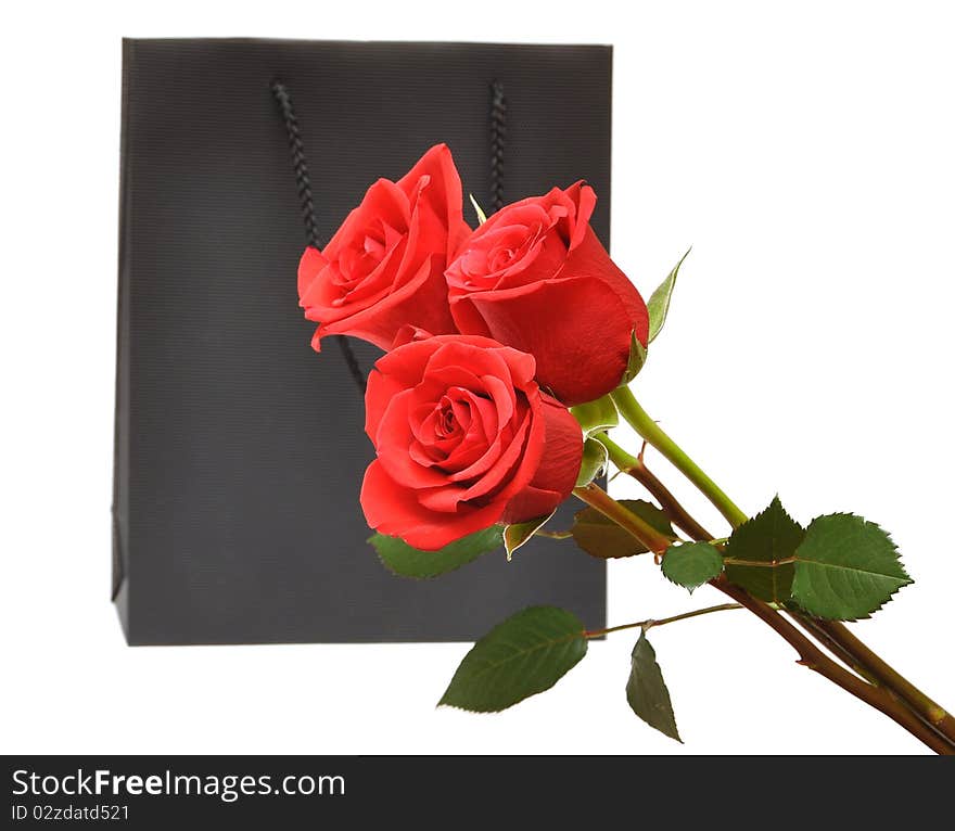 Black bag for a retail shopping experience with red roses. Black bag for a retail shopping experience with red roses