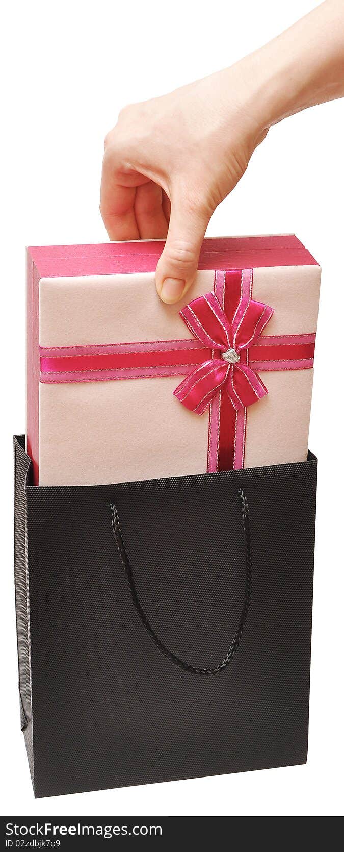 Female hand with beautiful gift box