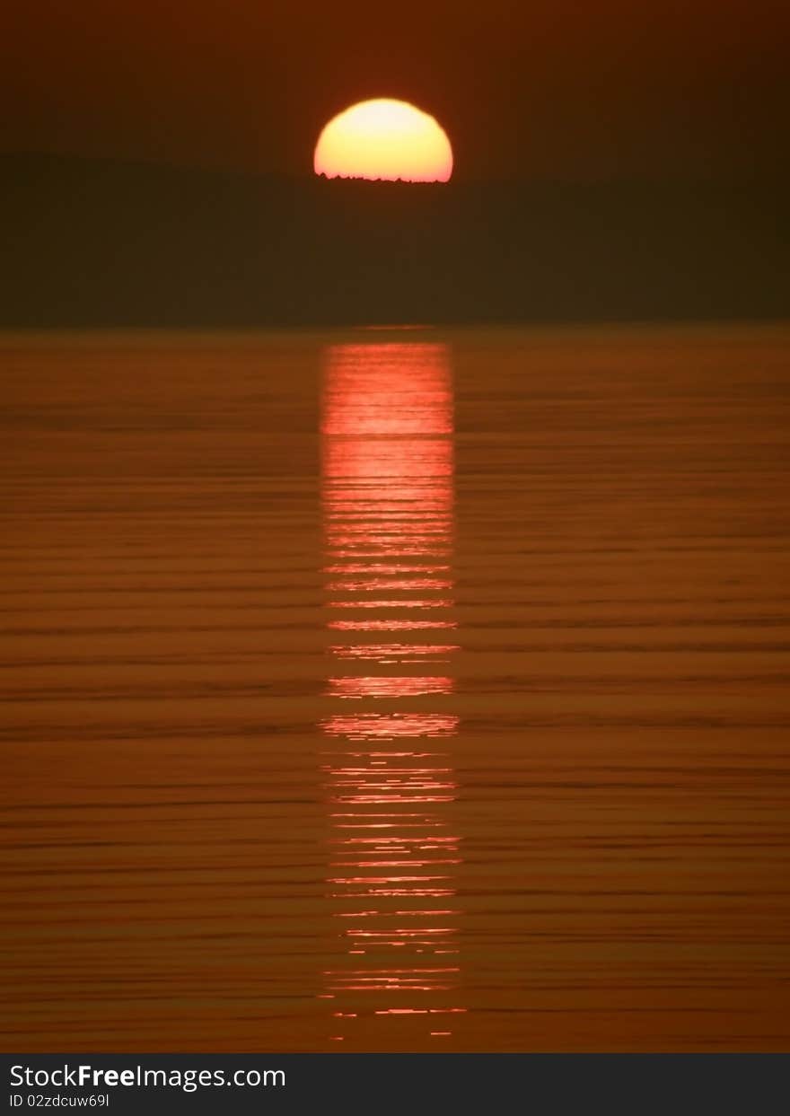 Sunset and ripples on sea