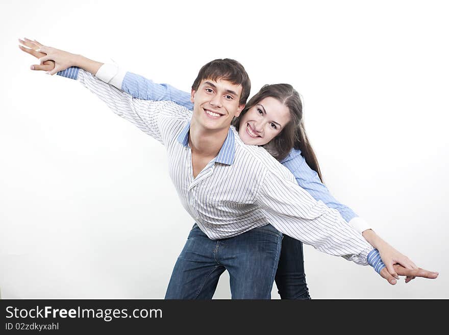 Two young happy person with the hands lifted upwards. Two young happy person with the hands lifted upwards