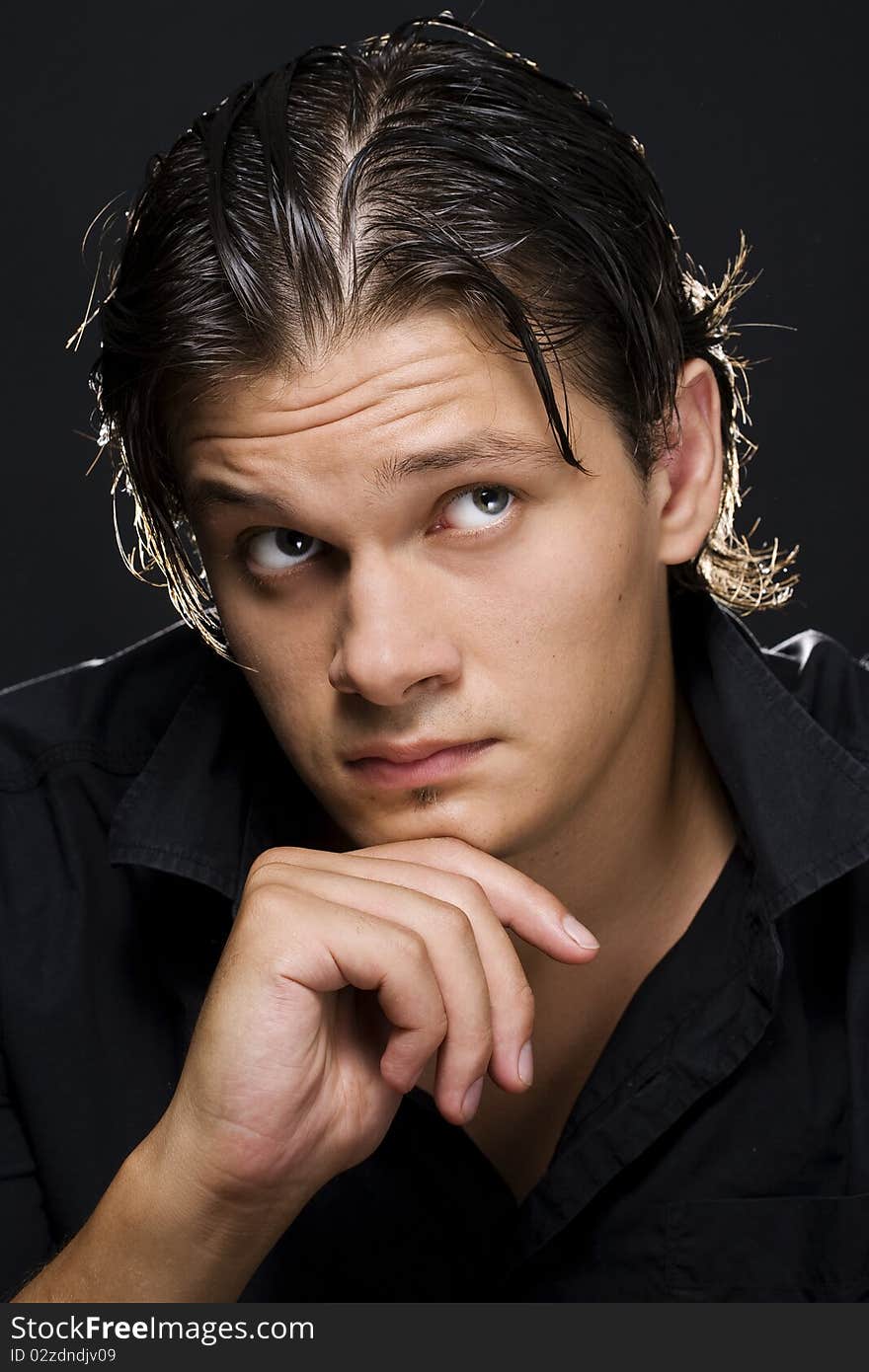 Portrait of young handsome man looking at camera