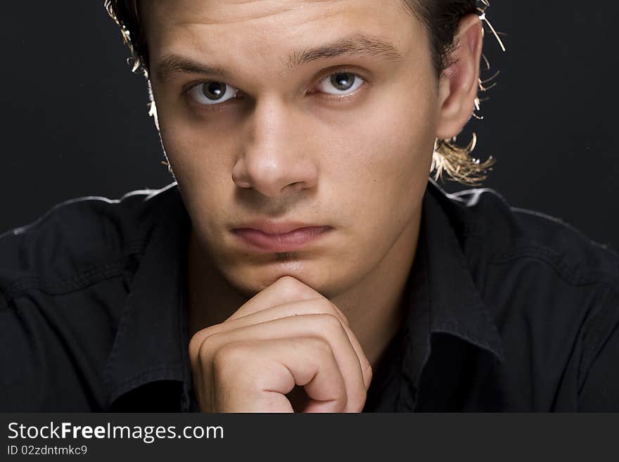 Portrait of young handsome man looking at camera