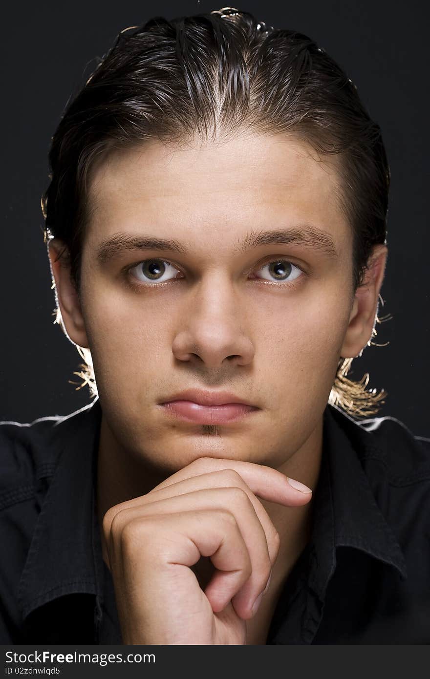 Portrait of young handsome man looking at camera