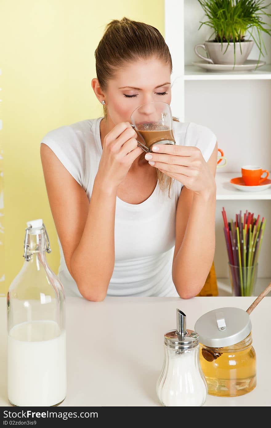 Beauty, young girl drinking coffee latte