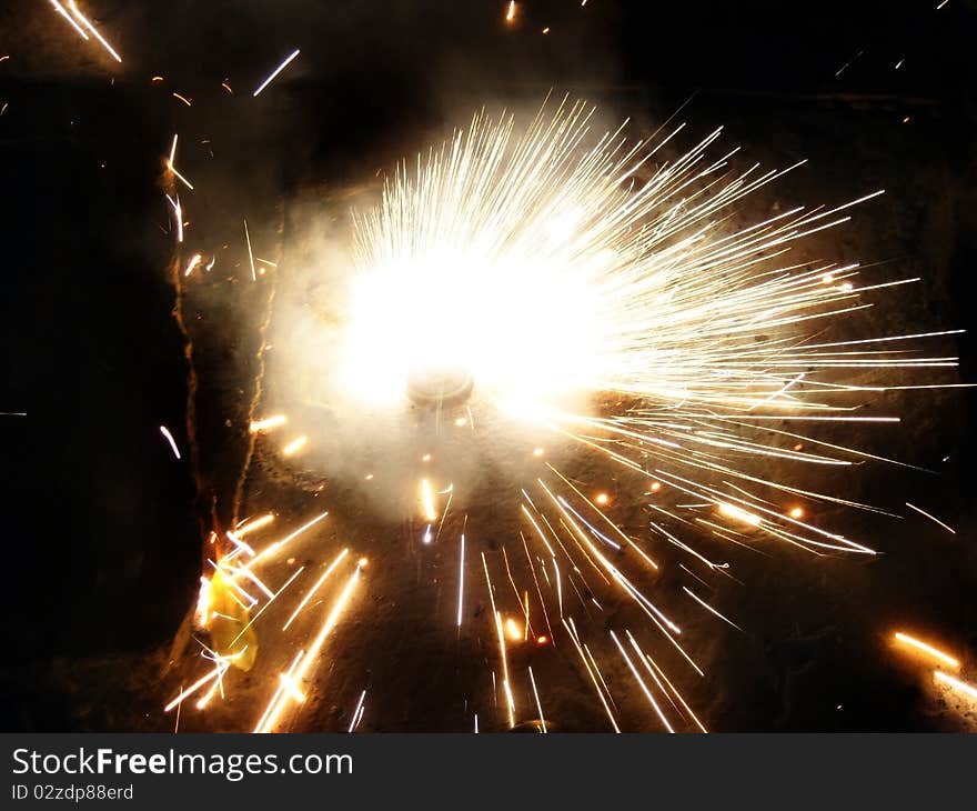 Spiraling firework on the occasion of Diwali in India. This festival is celebrated in the memory of Lord Rama overcoming the Evil Ravana. Spiraling firework on the occasion of Diwali in India. This festival is celebrated in the memory of Lord Rama overcoming the Evil Ravana.