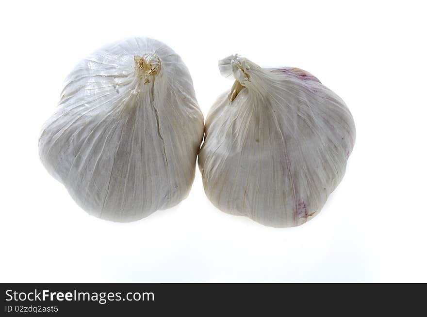 Two garlic bulbs - isolated on white. Two garlic bulbs - isolated on white