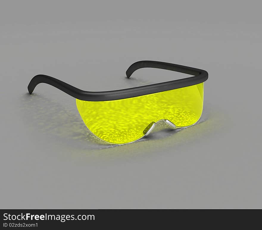 Yellow science glasses with some caustics over gray surface. Yellow science glasses with some caustics over gray surface