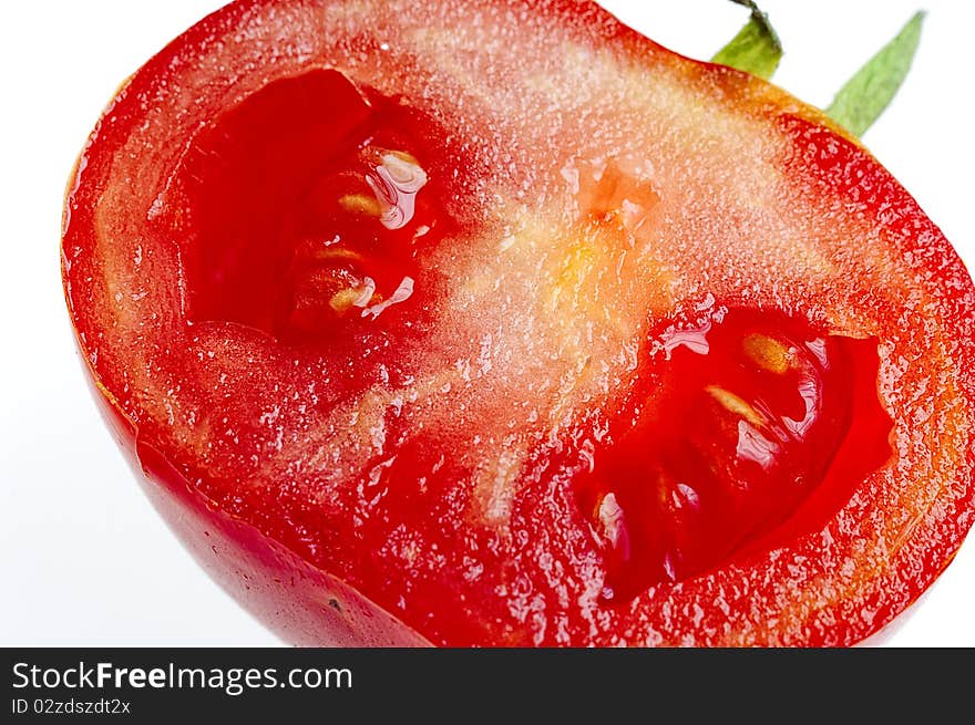 Macro shot of cut Tomato on white. Macro shot of cut Tomato on white