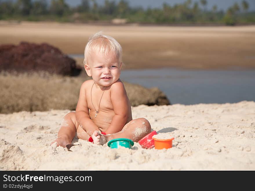Portrait of 1-2 years boy playing on the beach. Portrait of 1-2 years boy playing on the beach