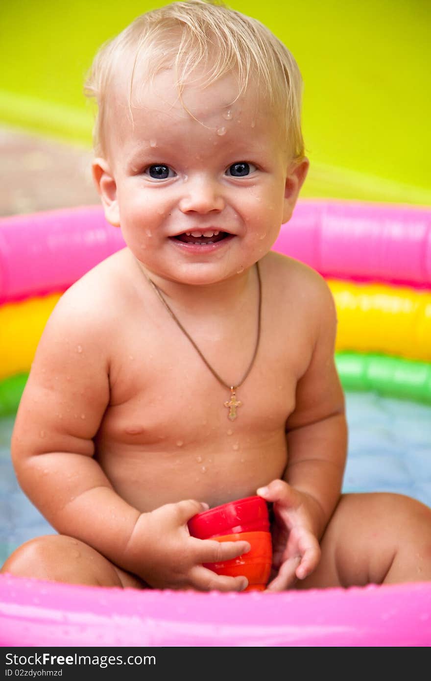 Small boy bathing in the pool