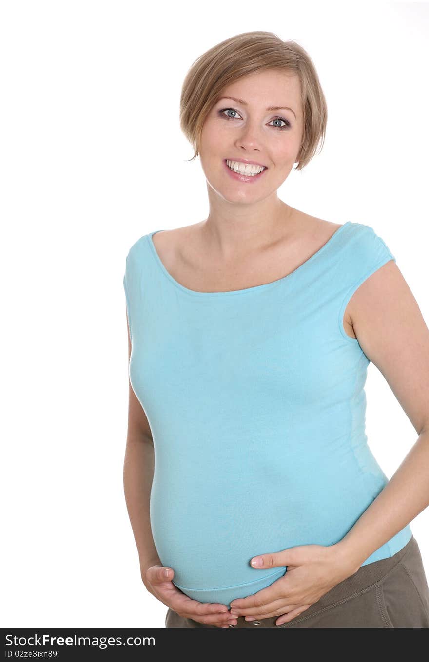 Young pregnant woman in a studio setting isolated over white.