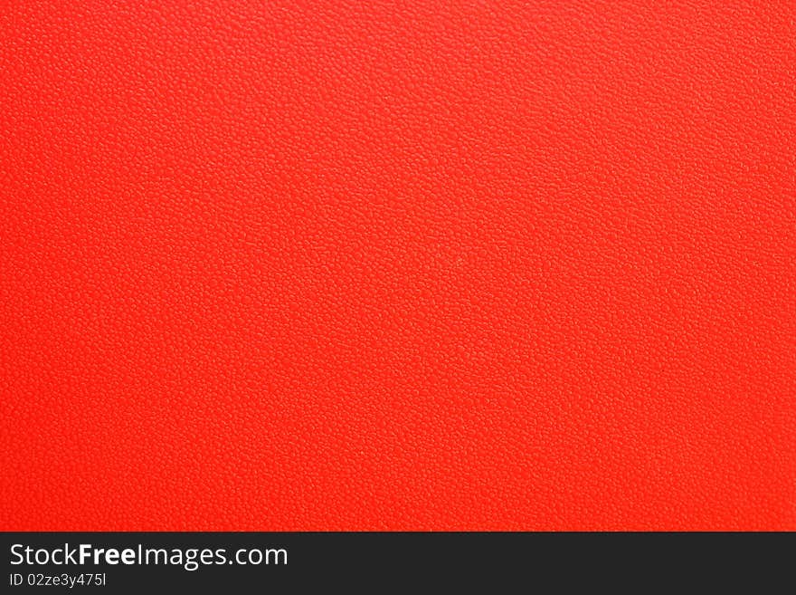 a red plastic surface texture. a red plastic surface texture