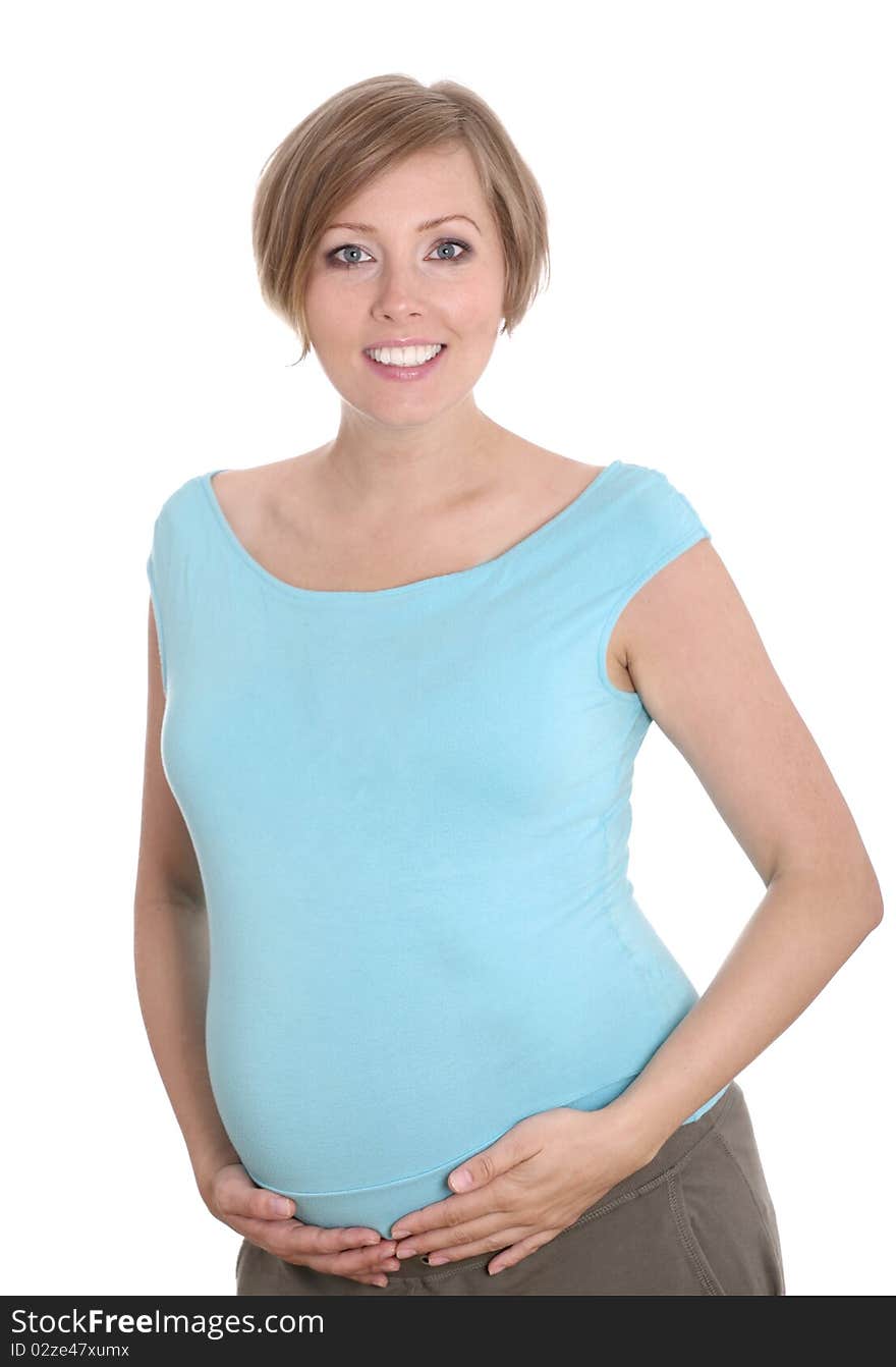 Young pregnant woman in a studio setting isolated over white.