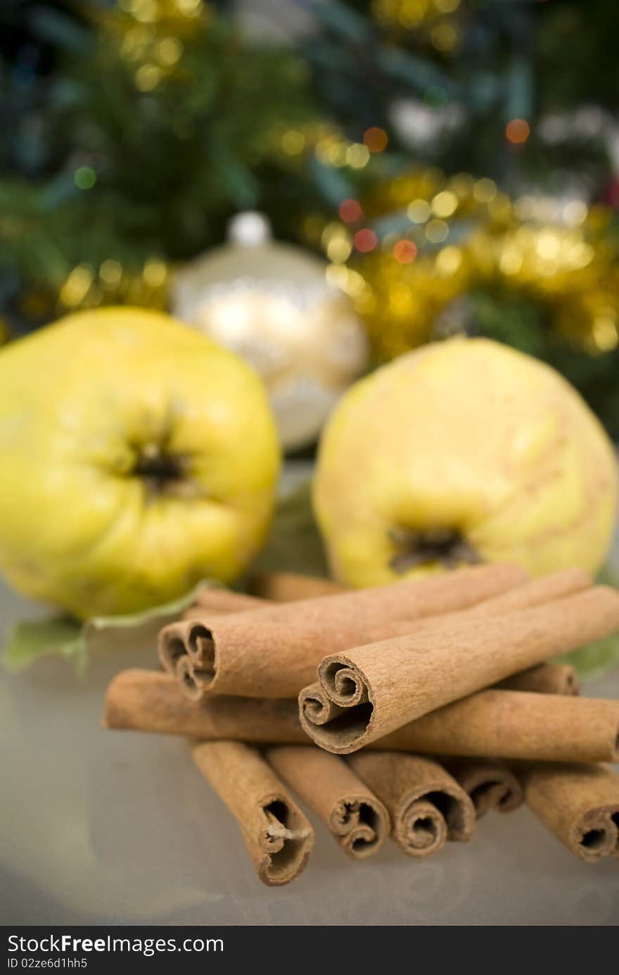 Cinnamon and apples on glass table