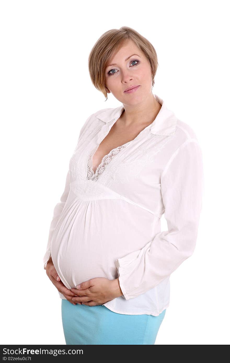 Young pregnant woman in a studio setting isolated over white.