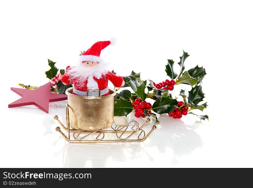 Santa claus in his golden sled isolated over white