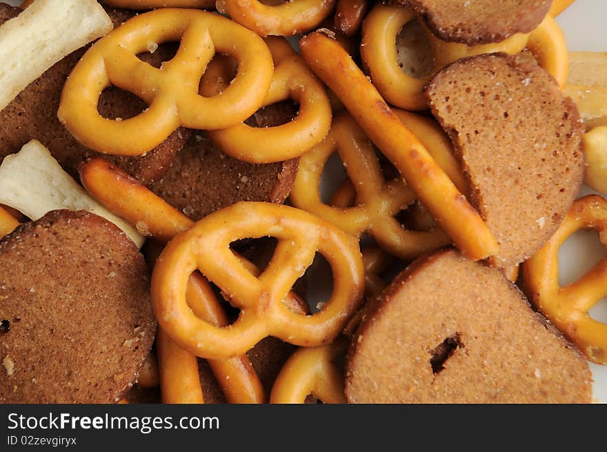 A bunch of pretzels and other breads assorted in a various trail mix. A bunch of pretzels and other breads assorted in a various trail mix.